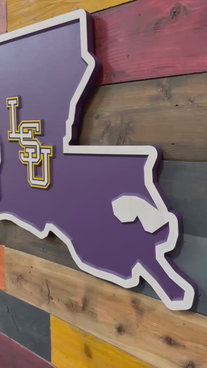 Video showcasing dimensional carving depth and handcrafted Louisiana shaped LSU wall art with layered purple and gold detail