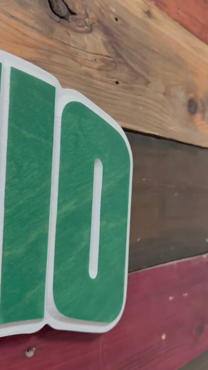 Video showing dimensional carved detail and handcrafted finish of an Ohio University Bobcats OHIO wood sign made by Cornbread Custom Signs