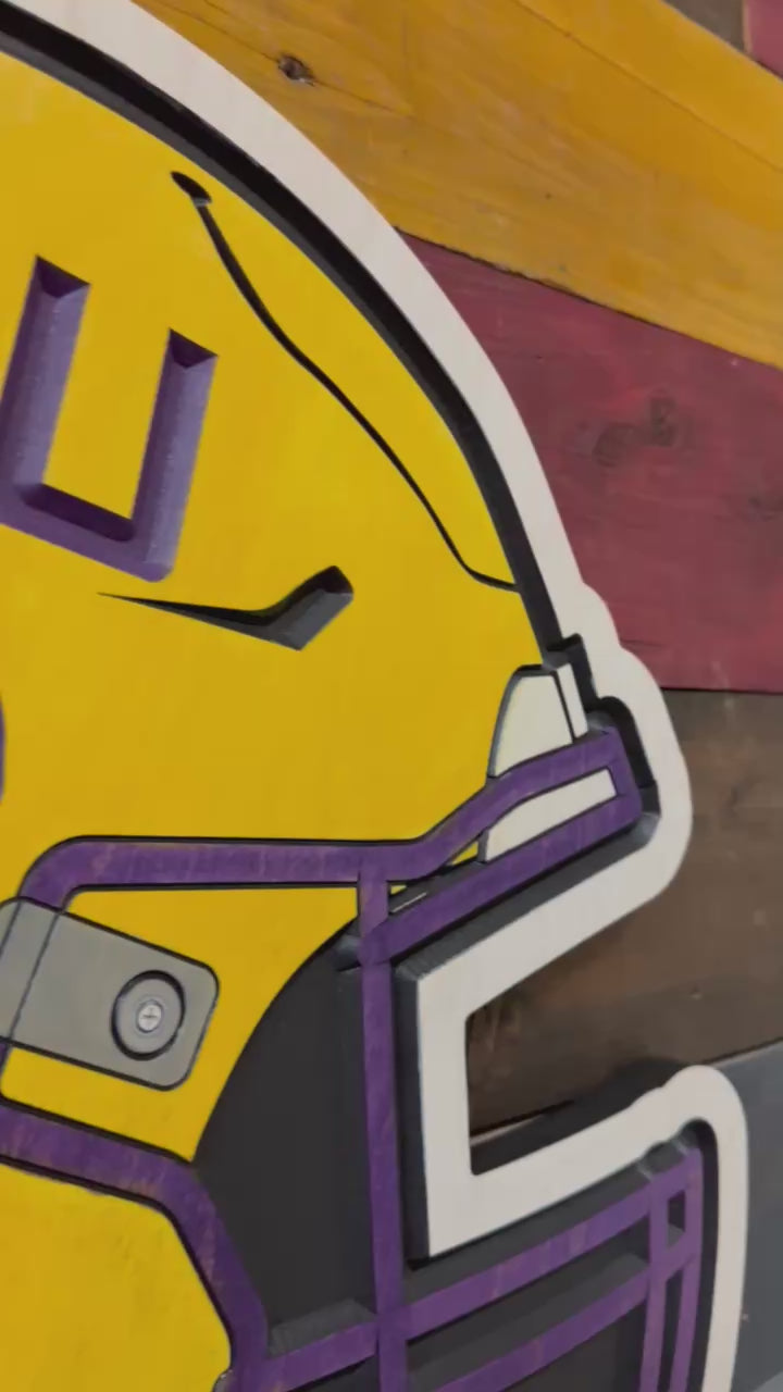 Take a closer look at our officially licensed LSU Tigers Football Helmet Wood Sign. Precision CNC carved, hand-painted, and handcrafted in Nebraska, this premium wall art showcases the iconic LSU football helmet and is perfect for fan caves, offices, game rooms, and Tiger fans.