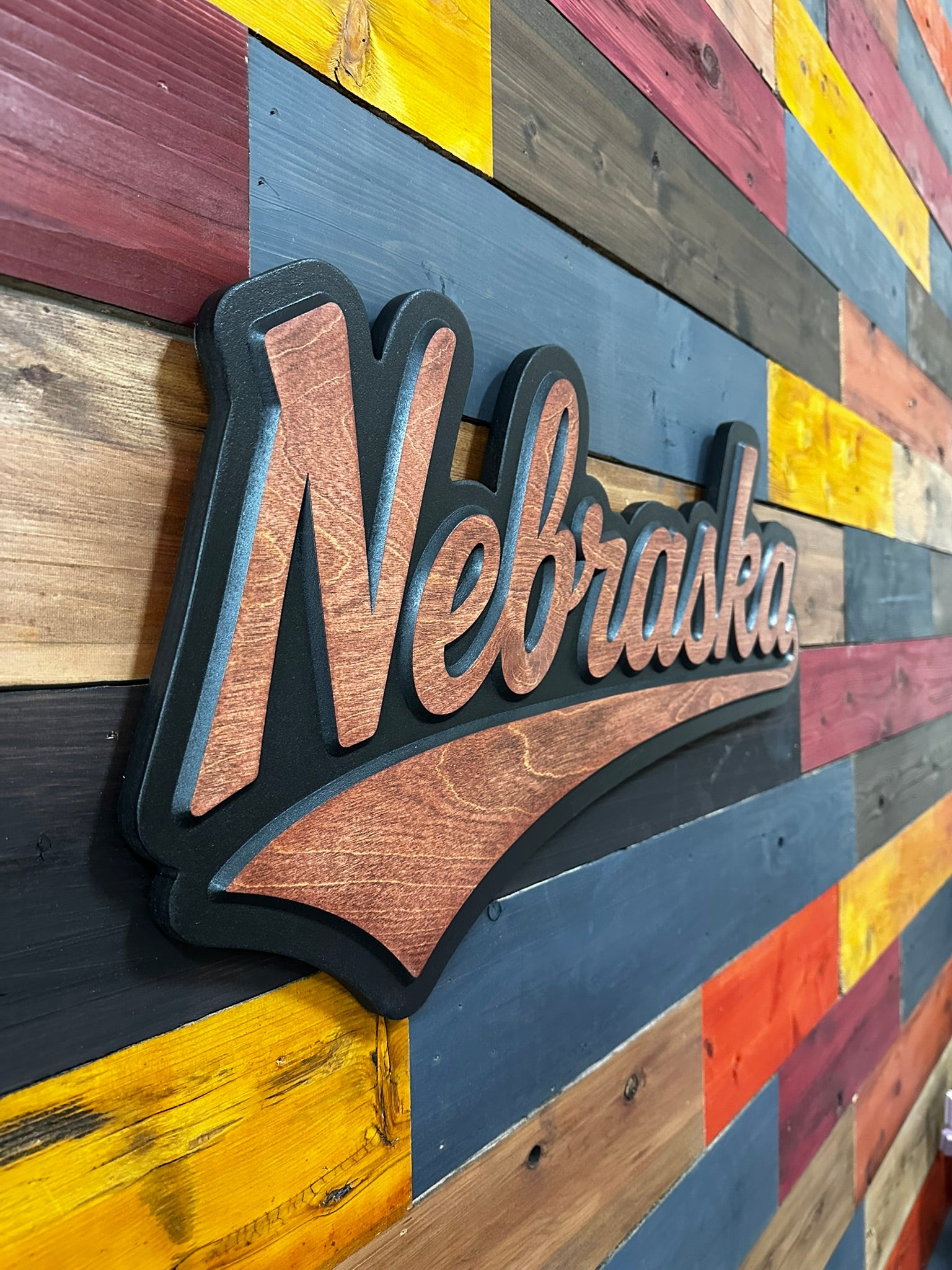 Video of Nebraska Cornhuskers jersey font wood sign with wood-tone finish