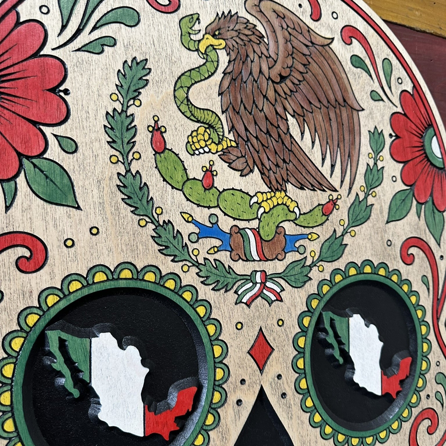 Video showing the carved details and hand painted finish of a Mexican sugar skull wood sign from the Heritage Collection