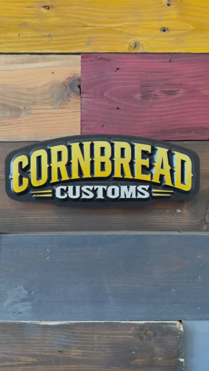 Handcrafted omaha sign shop Cornbread Customs yellow and black carved logo wood sign