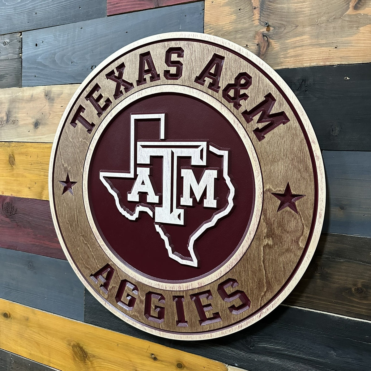 Dimensional Texas A&M Aggies round carved wood sign with maroon lettering and natural wood finish