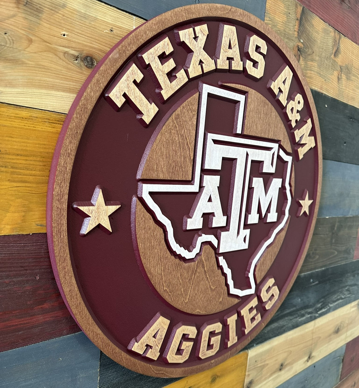 Detail view of maroon and natural wood finish on Texas A&M Aggies round sign