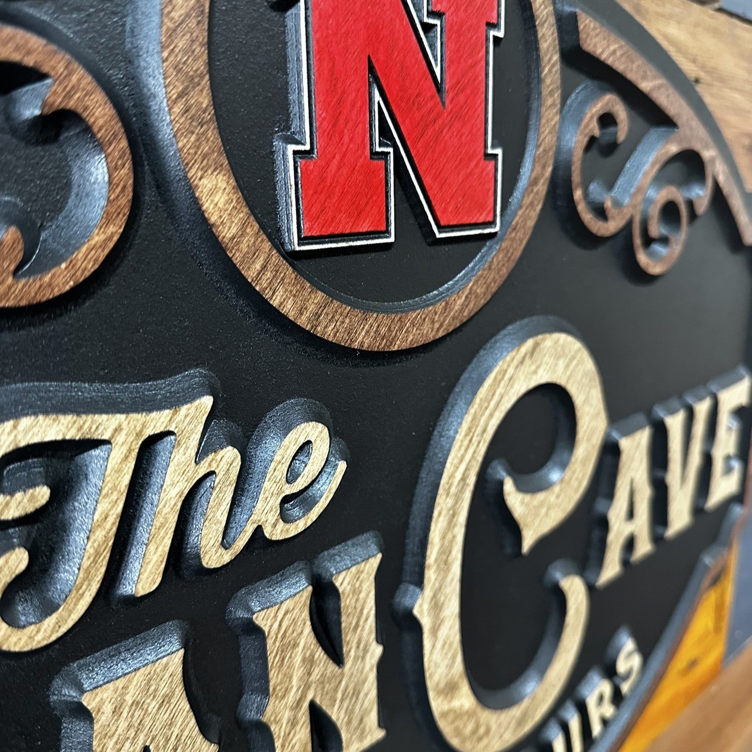 Side profile of Nebraska Man Cave wood sign