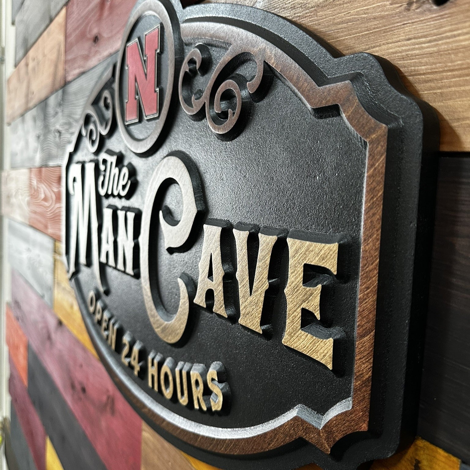Nebraska Man Cave wood sign displayed on wall
