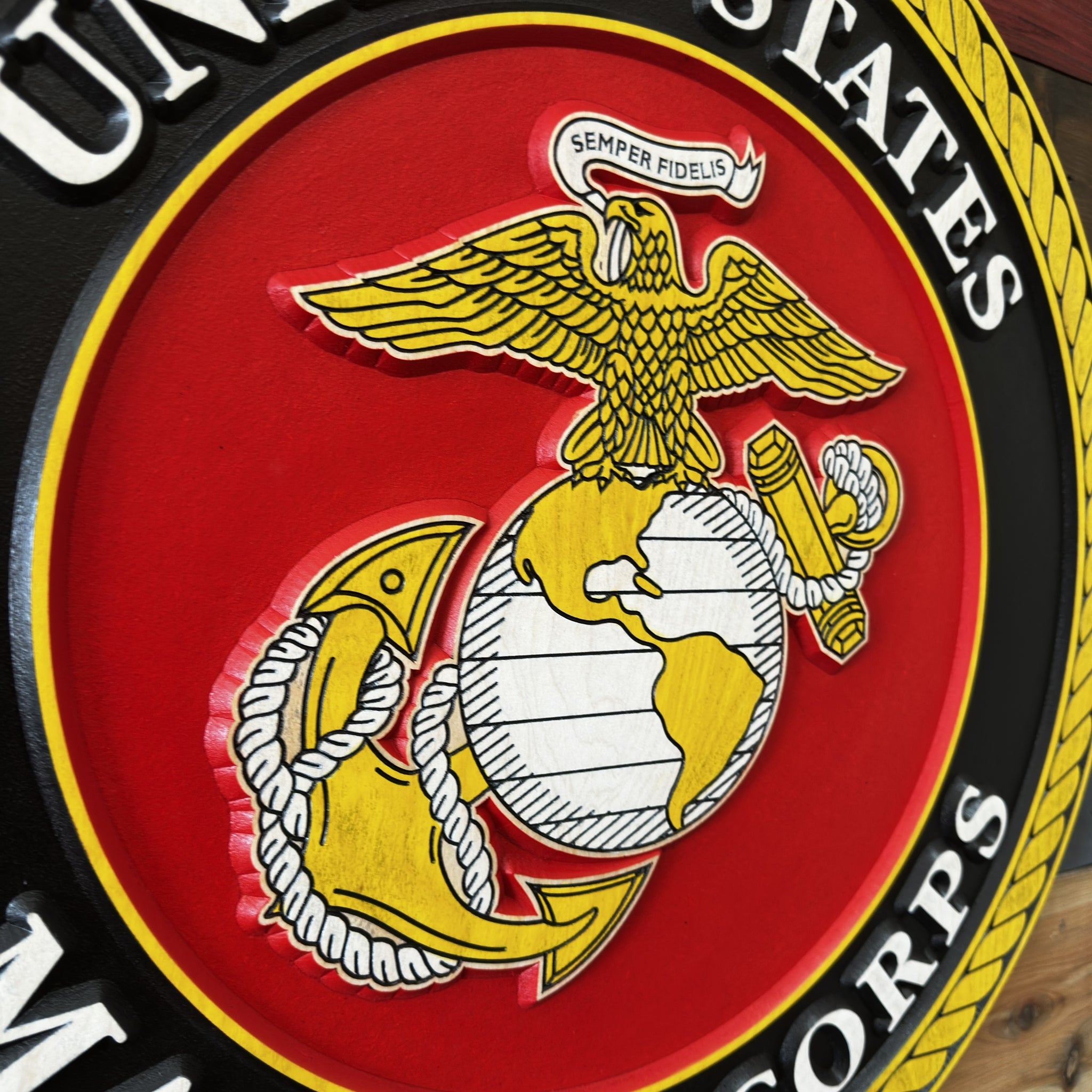 Angled view of United States Marine Corps emblem wood sign