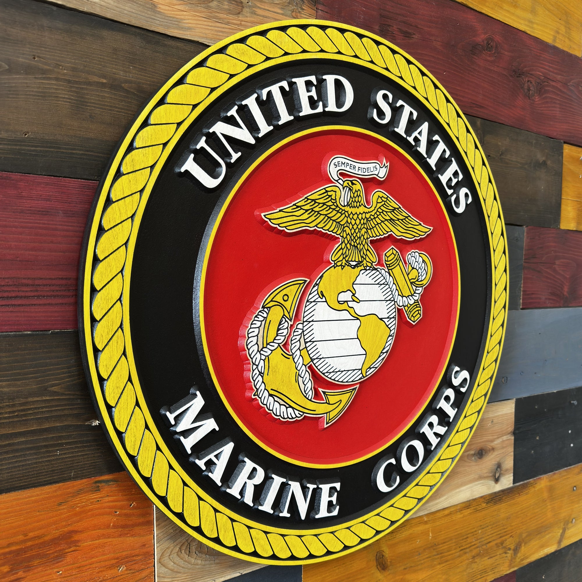 United States Marine Corps emblem wood sign displayed on wall