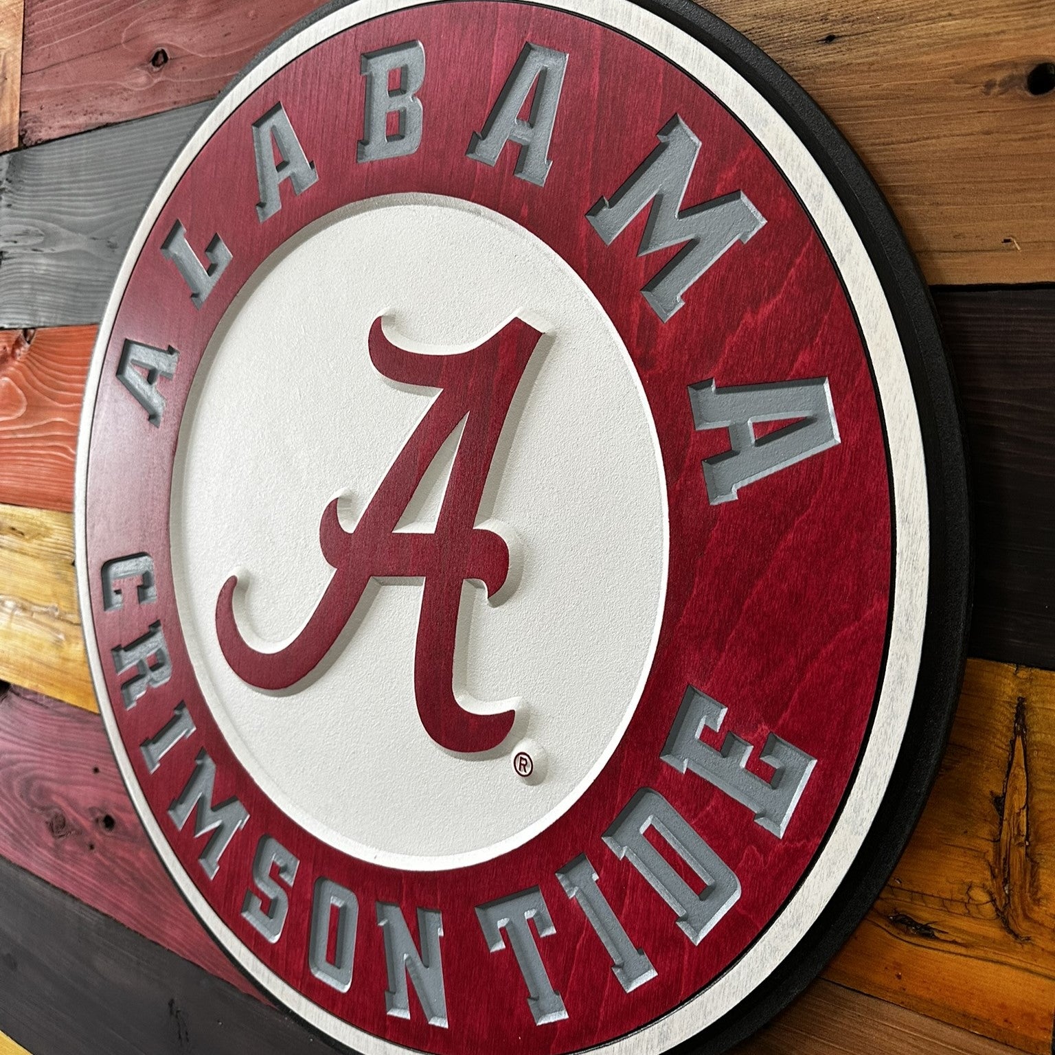 Angled view of University of Alabama round wood sign
