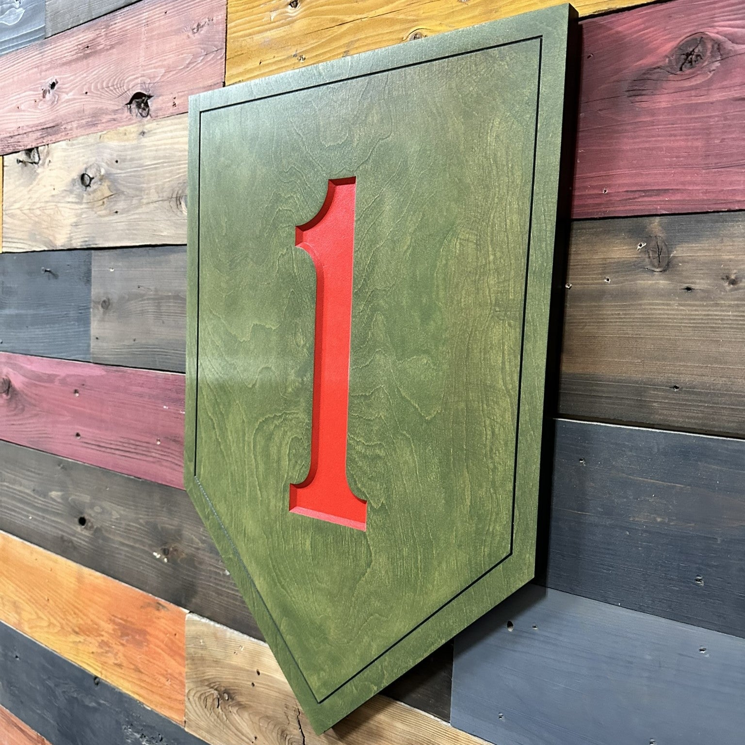Side profile of US Army 1st Infantry Division Big Red One carved wood wall sign showing carved thickness