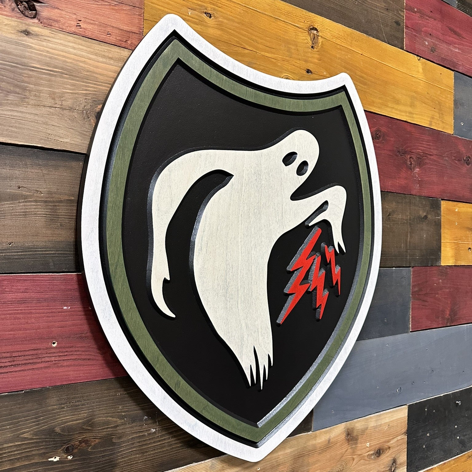 Side profile of US Army 23rd Headquarters Special Troops Ghost Army carved wood wall sign showing carved thickness