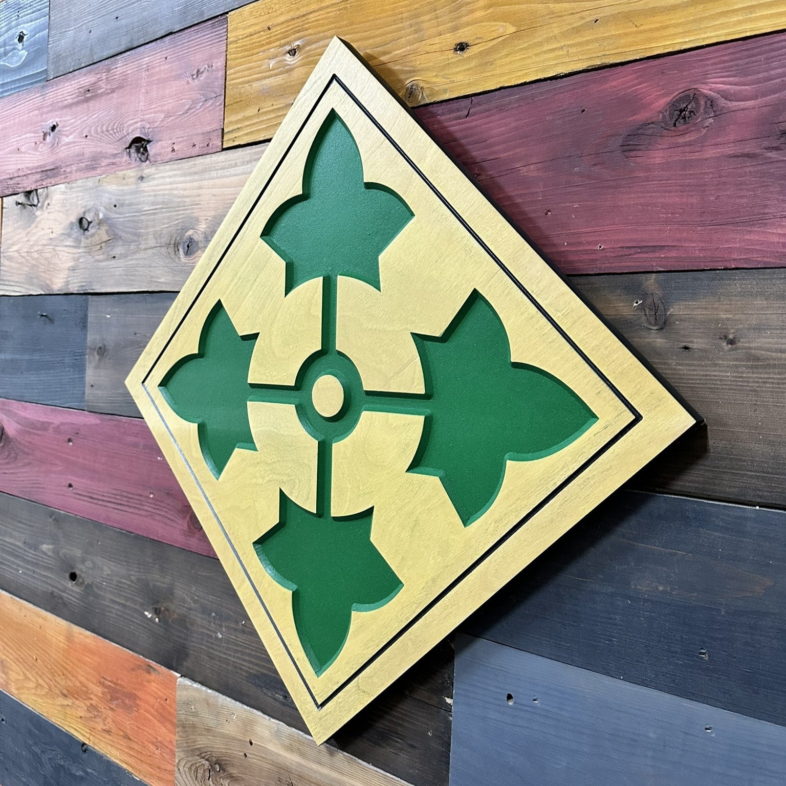 Side profile of US Army 4th Infantry Division Ivy carved wood wall sign showing carved thickness