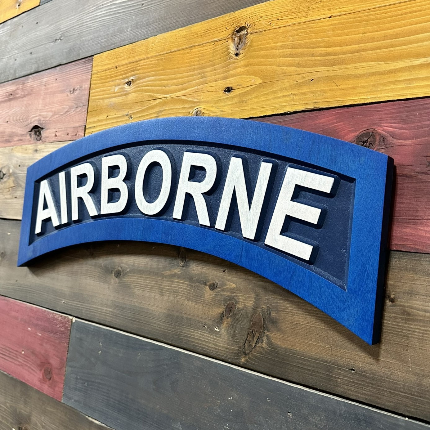 US Army Airborne tab navy blue carved wood wall sign mounted on wall