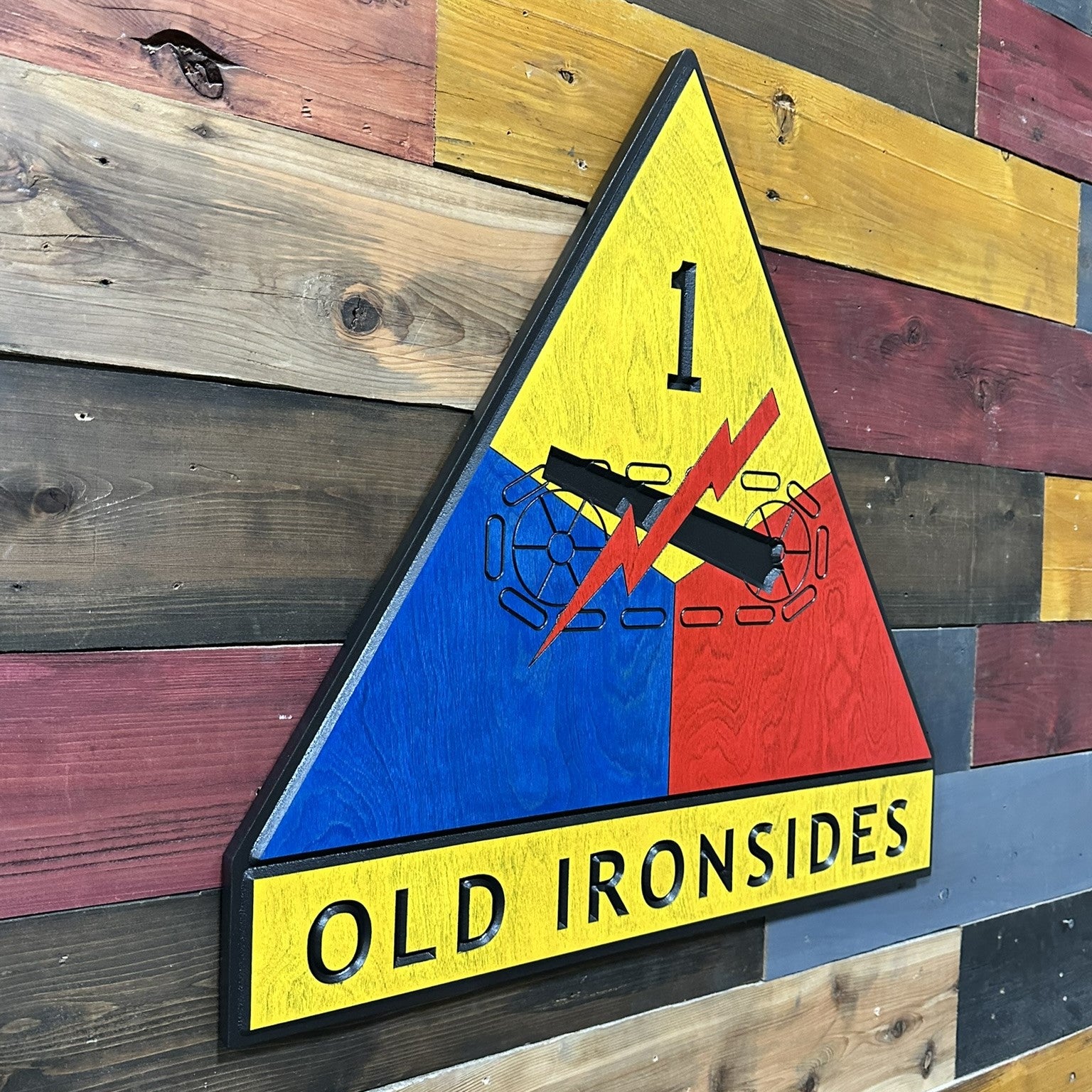 Side profile of US Army 1st Armored Division Old Ironsides wood wall sign showing carved depth and thickness