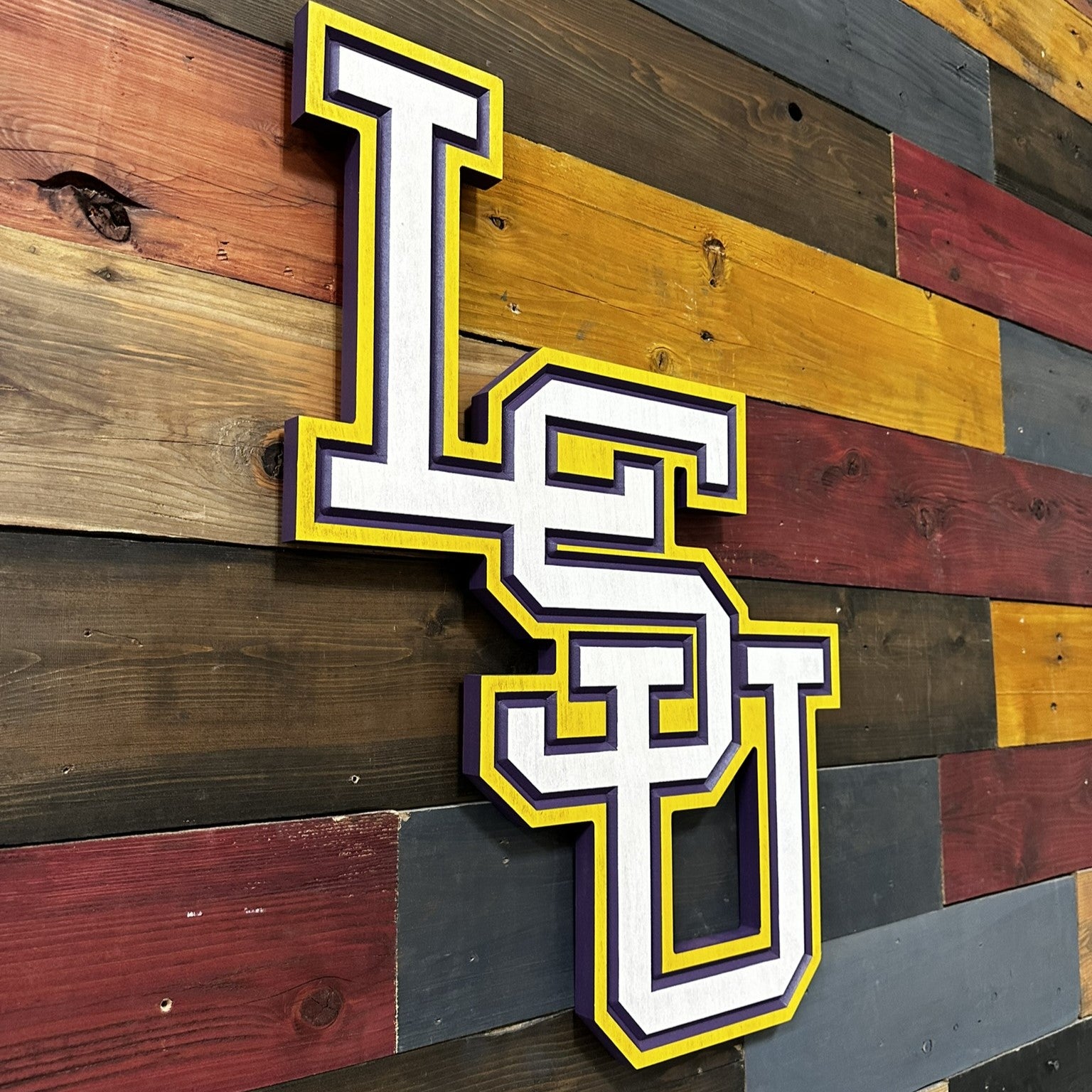 Side profile of vertical LSU Tigers carved wood logo sign highlighting layered construction and dimensional carved depth detail