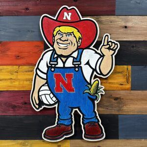 Herbie Husker holding volleyball wall sign by Cornbread Custom Signs