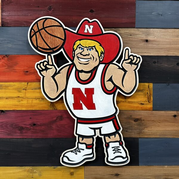 Herbie Husker holding basketball wall sign by Cornbread Custom Signs